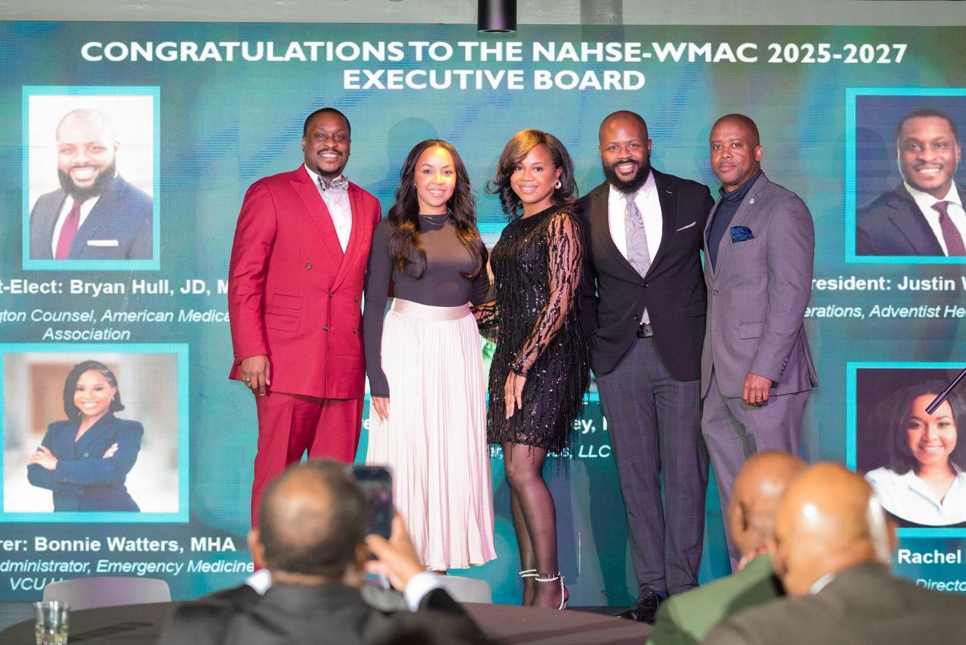 Chapter executive board recognized on stage at the Winter Soirée